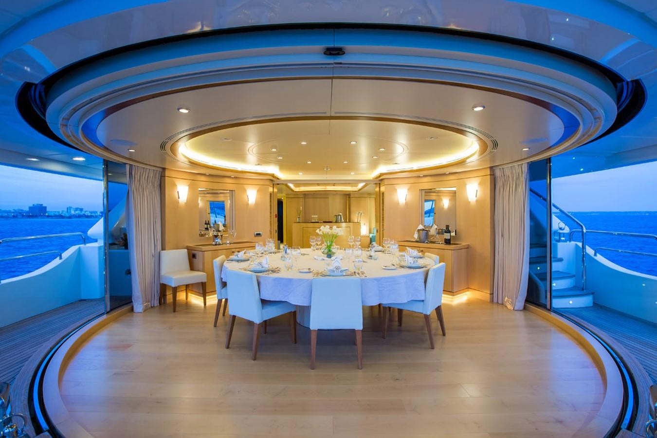 a room with tables and chairs aboard BLUE VISION Yacht for Sale