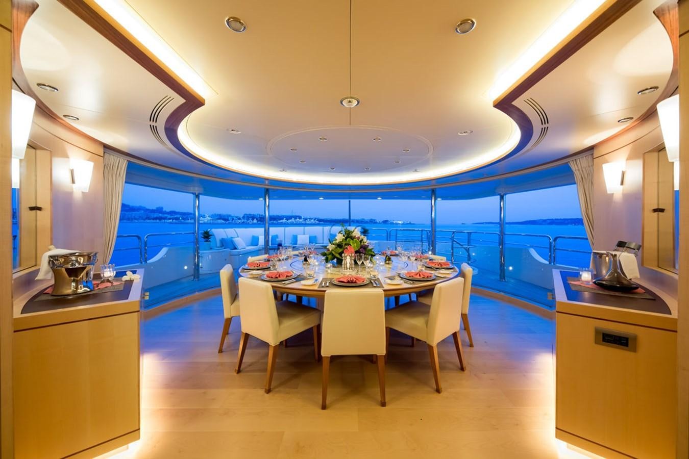 a large kitchen with a round table aboard BLUE VISION Yacht for Sale