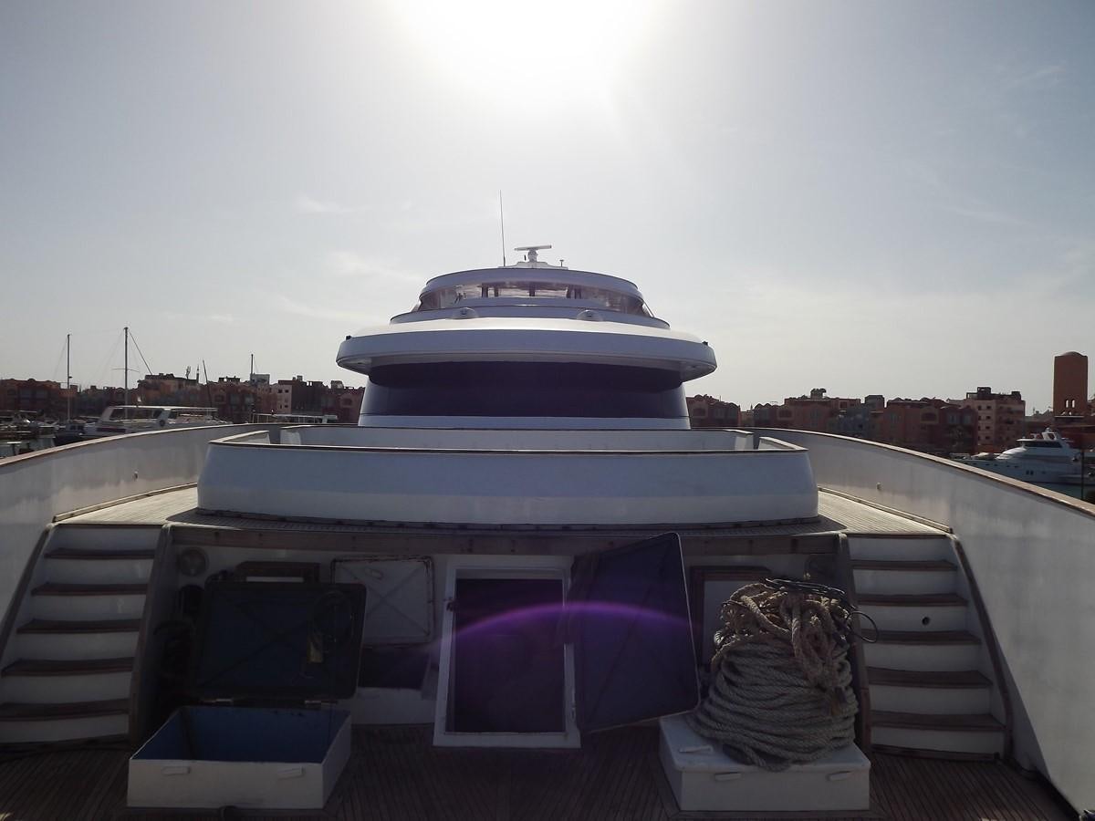 a boat on a deck aboard SCUBA SCENE Yacht for Sale