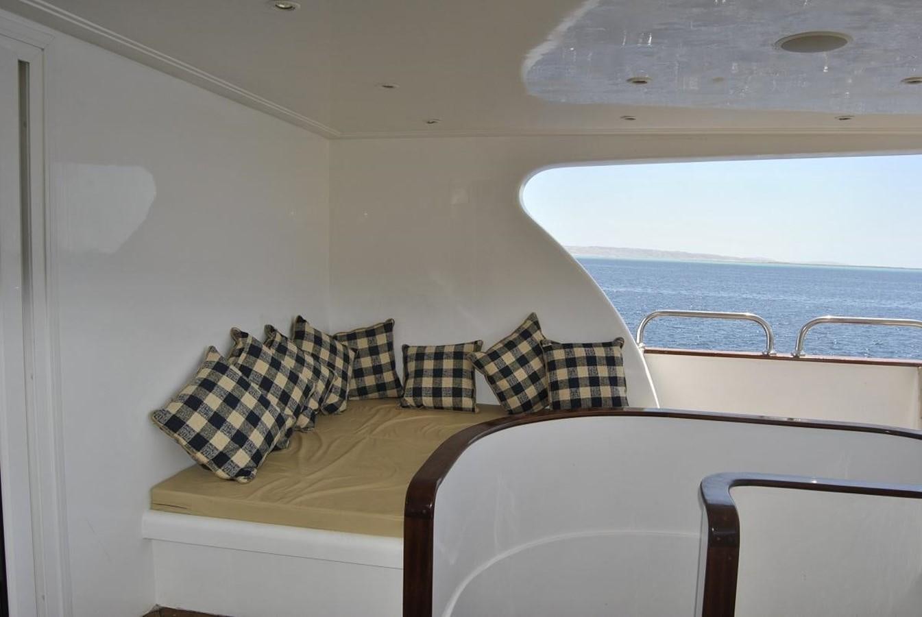 a bed with pillows on it aboard SCUBA SCENE Yacht for Sale