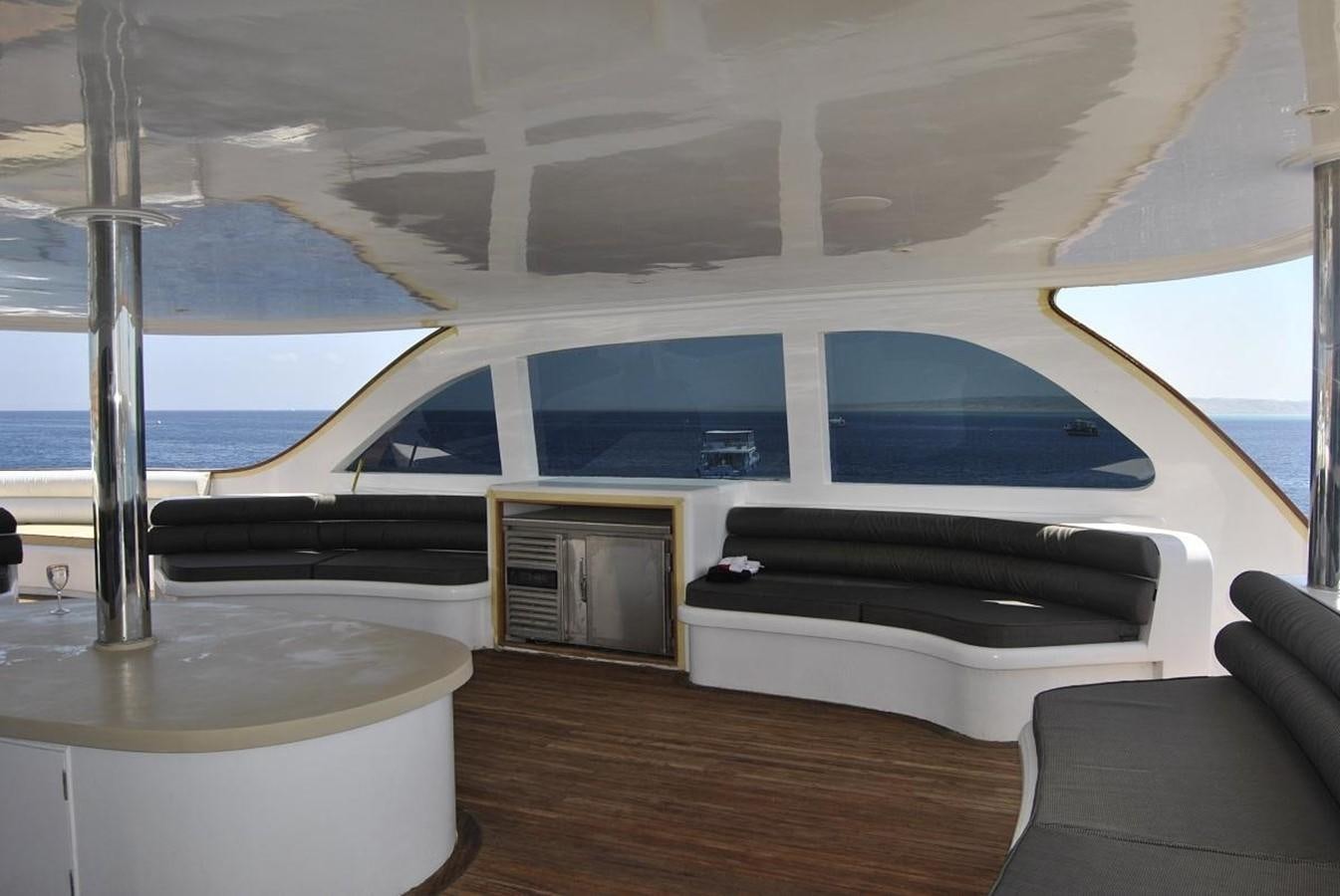 a room with a bed and a television aboard SCUBA SCENE Yacht for Sale