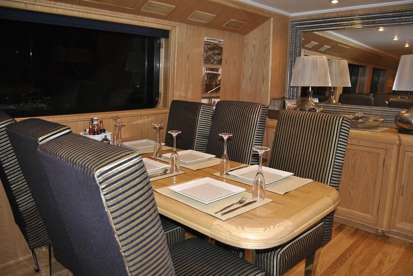 a room with a table and chairs aboard SCUBA SCENE Yacht for Sale