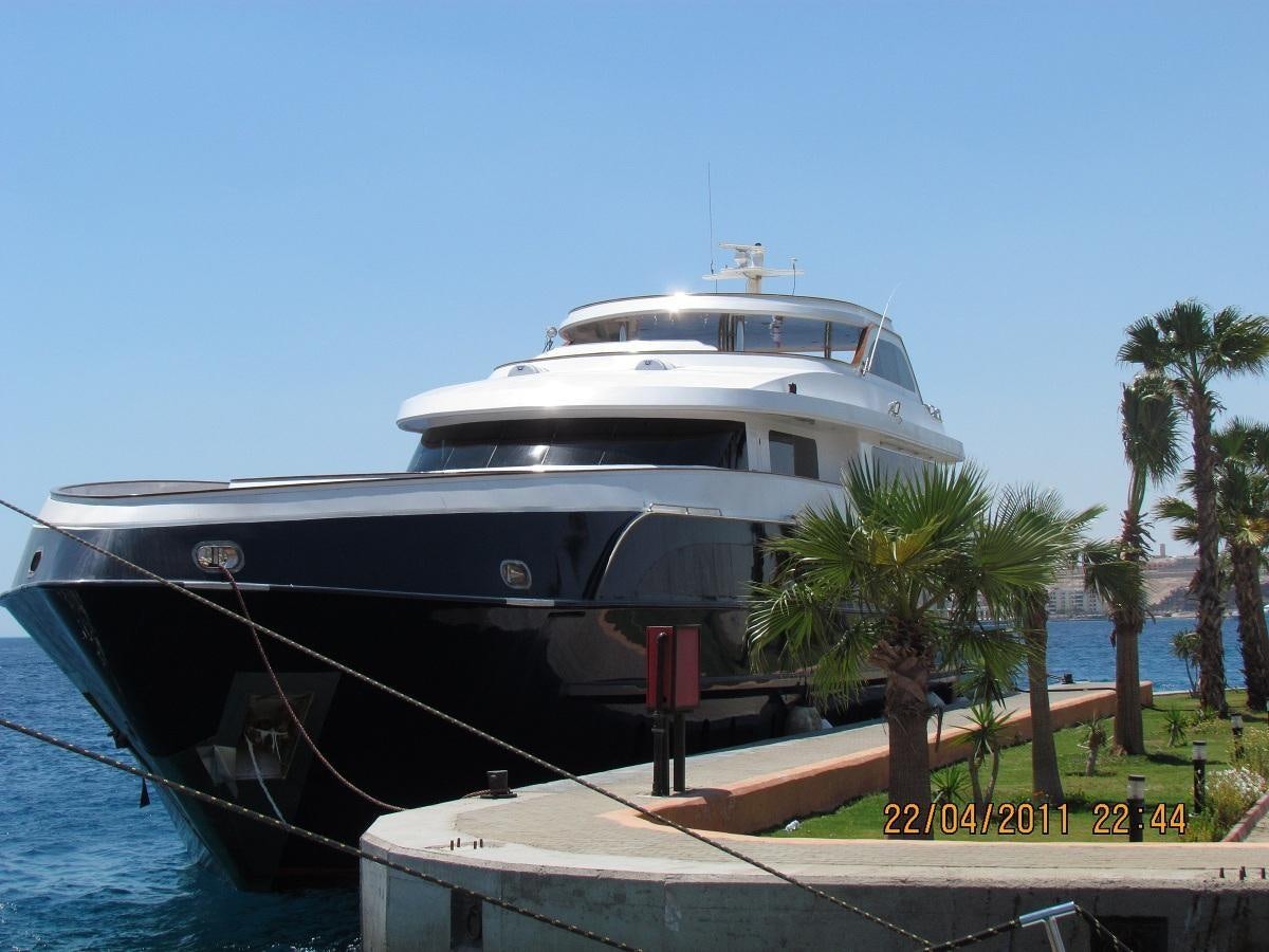 a large white boat docked aboard SCUBA SCENE Yacht for Sale