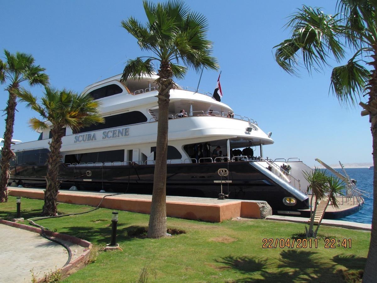 a boat parked on the side of a road aboard SCUBA SCENE Yacht for Sale