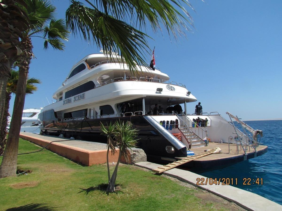 a boat docked at a pier aboard SCUBA SCENE Yacht for Sale