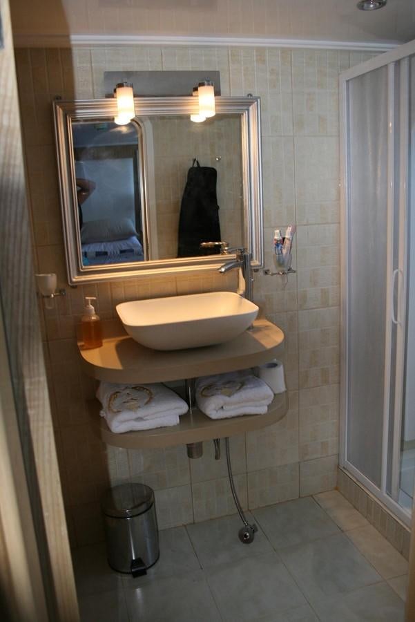 a bathroom with a large mirror aboard SCUBA SCENE Yacht for Sale