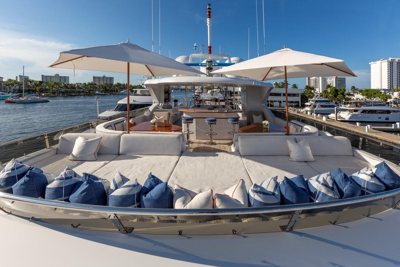 a boat with umbrellas on it aboard FAR FROM IT Yacht for Charter