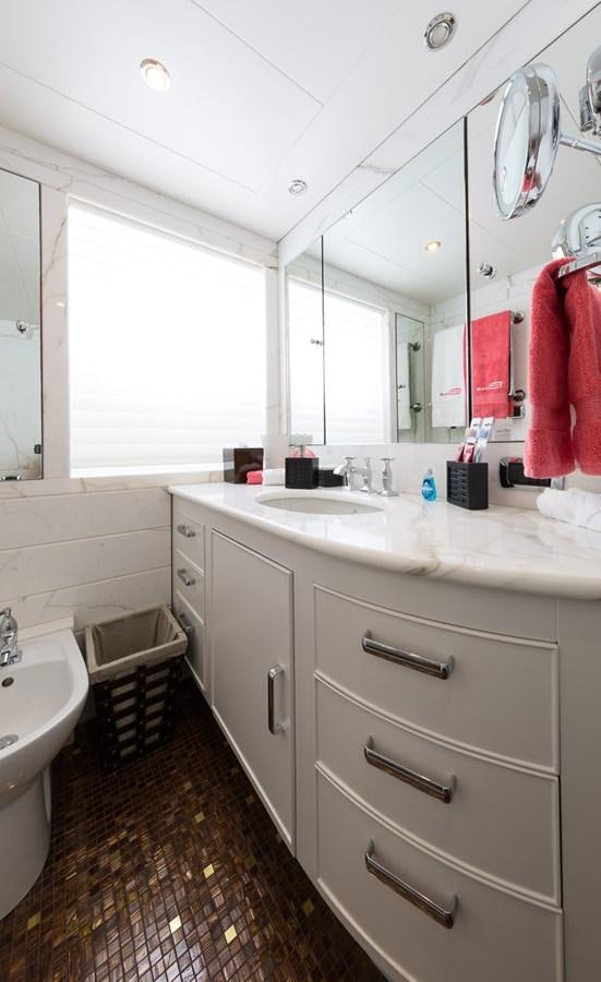 a bathroom with a sink and a mirror aboard BINA Yacht for Sale
