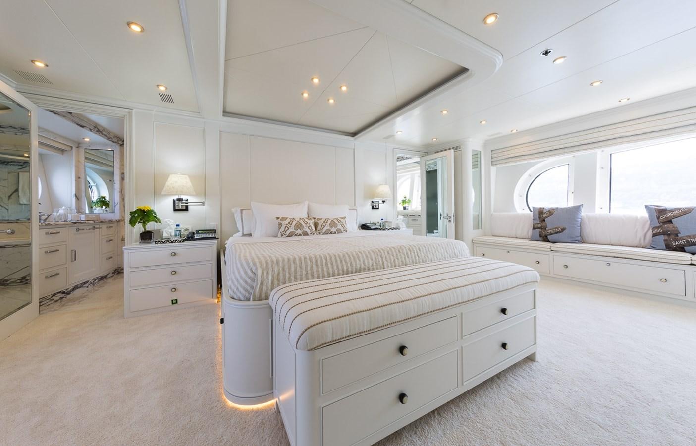 a large white bedroom with a large bed and a large window aboard BINA Yacht for Sale