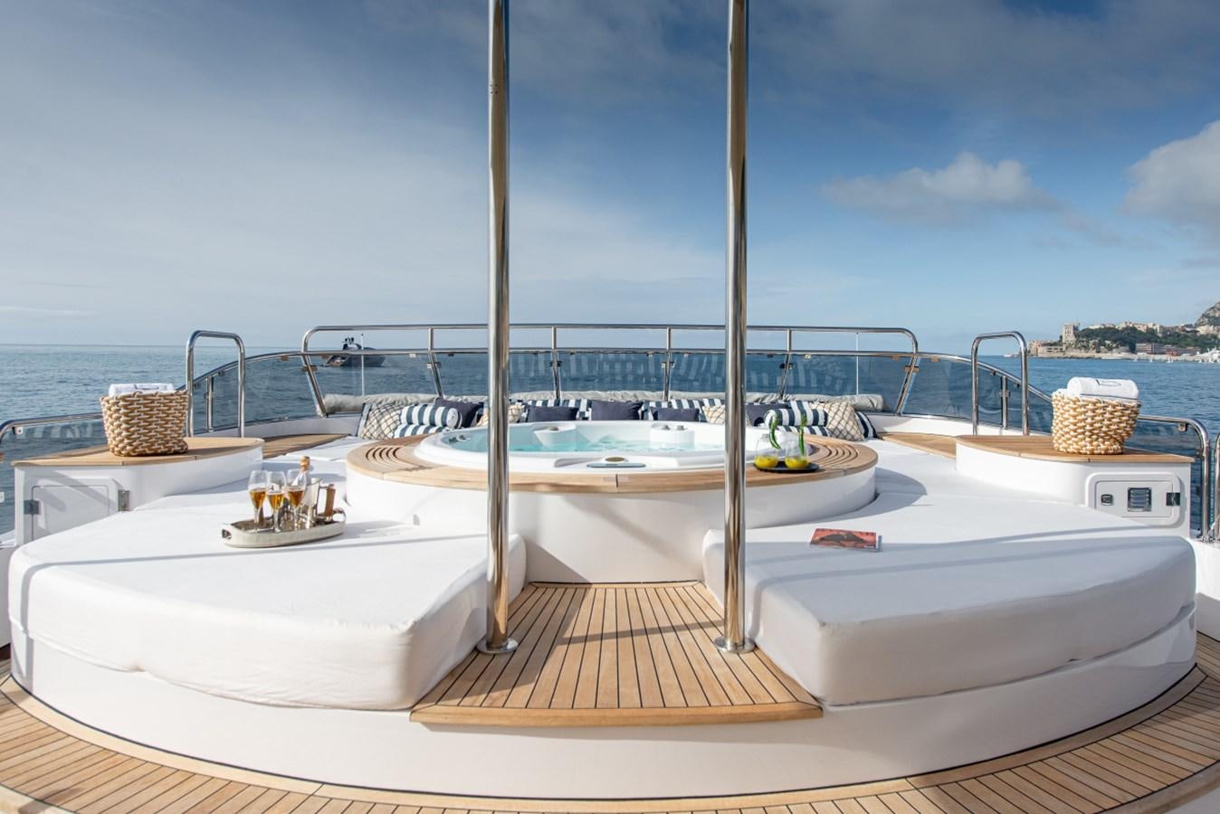 a white boat on a deck aboard BINA Yacht for Sale