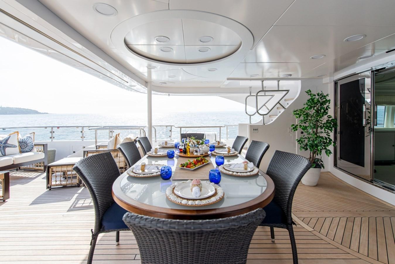 a dining room with a table and chairs aboard BINA Yacht for Sale