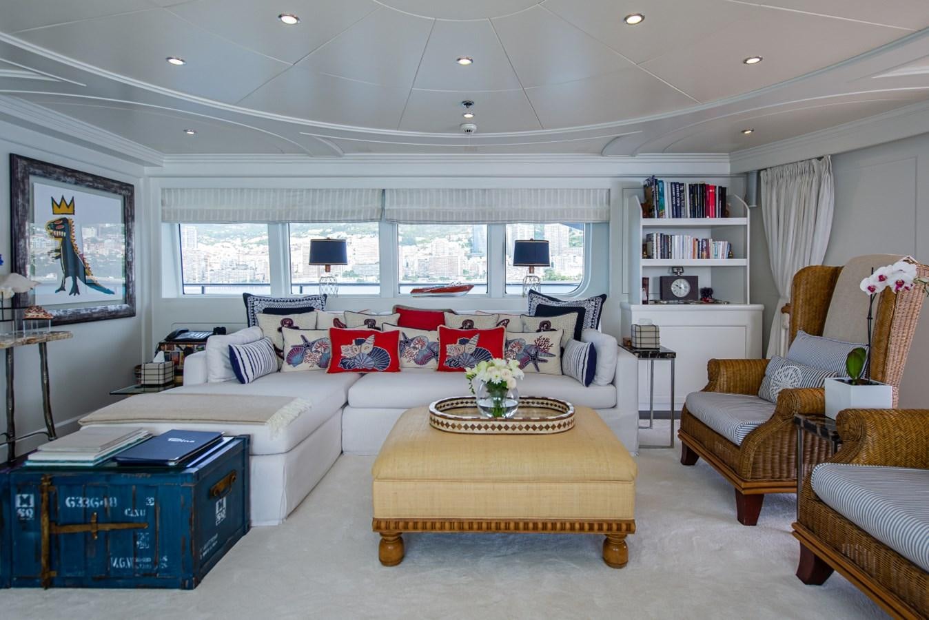 a living room with a couch and a coffee table aboard BINA Yacht for Sale