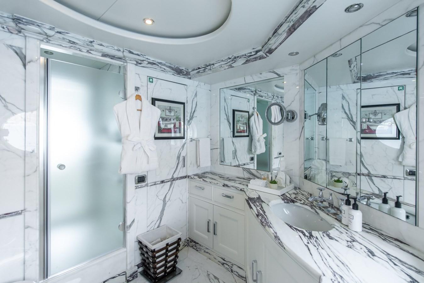 a bathroom with a sink and a mirror aboard BINA Yacht for Sale