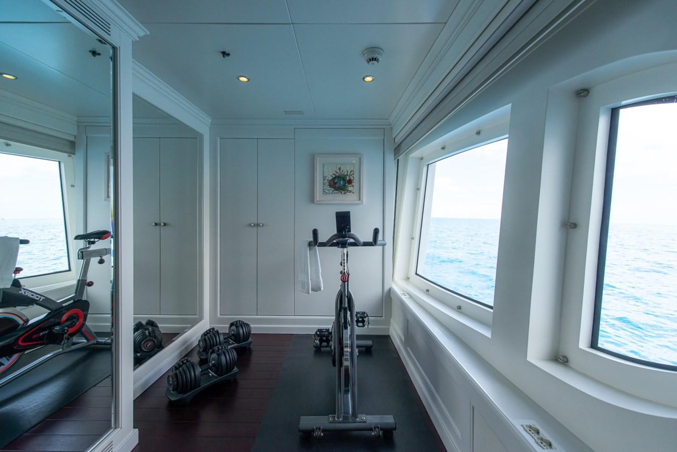 a room with a camera and a tripod aboard BINA Yacht for Sale