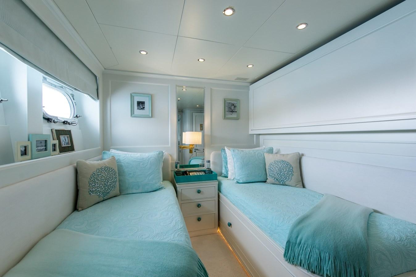 a couple of beds in a hotel room aboard BINA Yacht for Sale