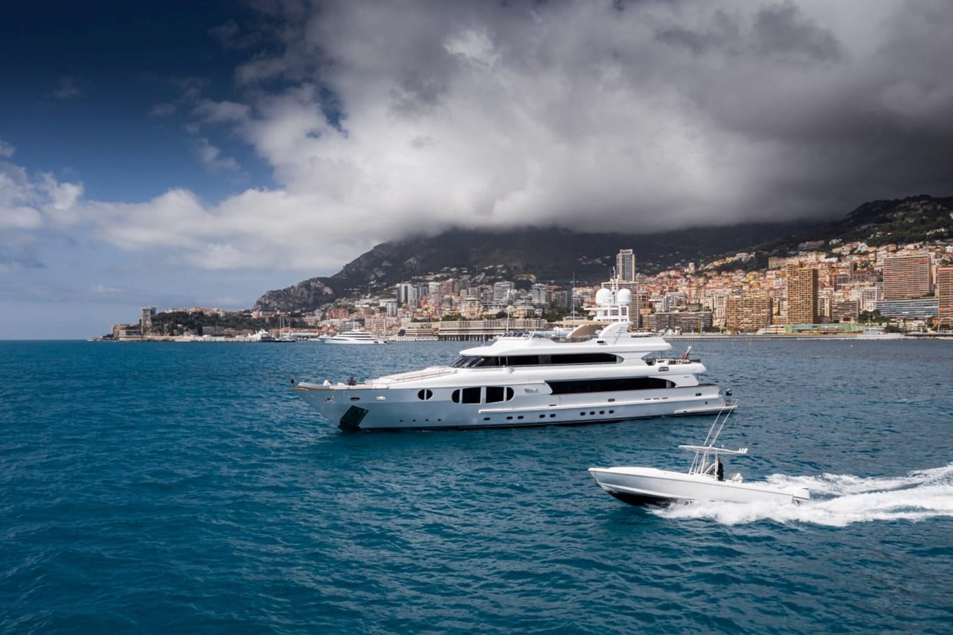 a couple of boats on the water aboard BINA Yacht for Sale
