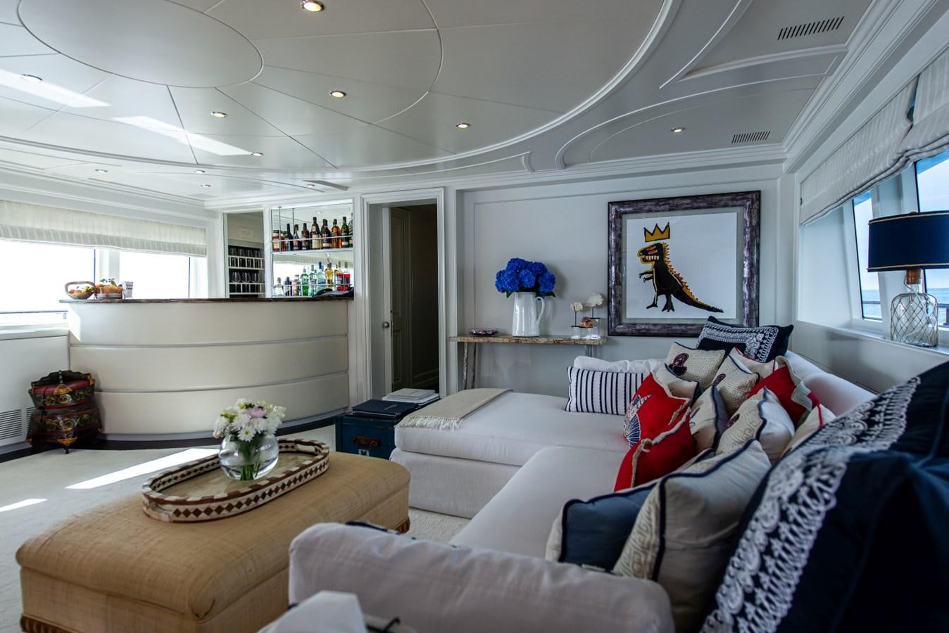 a living room with a couch and a coffee table aboard BINA Yacht for Sale