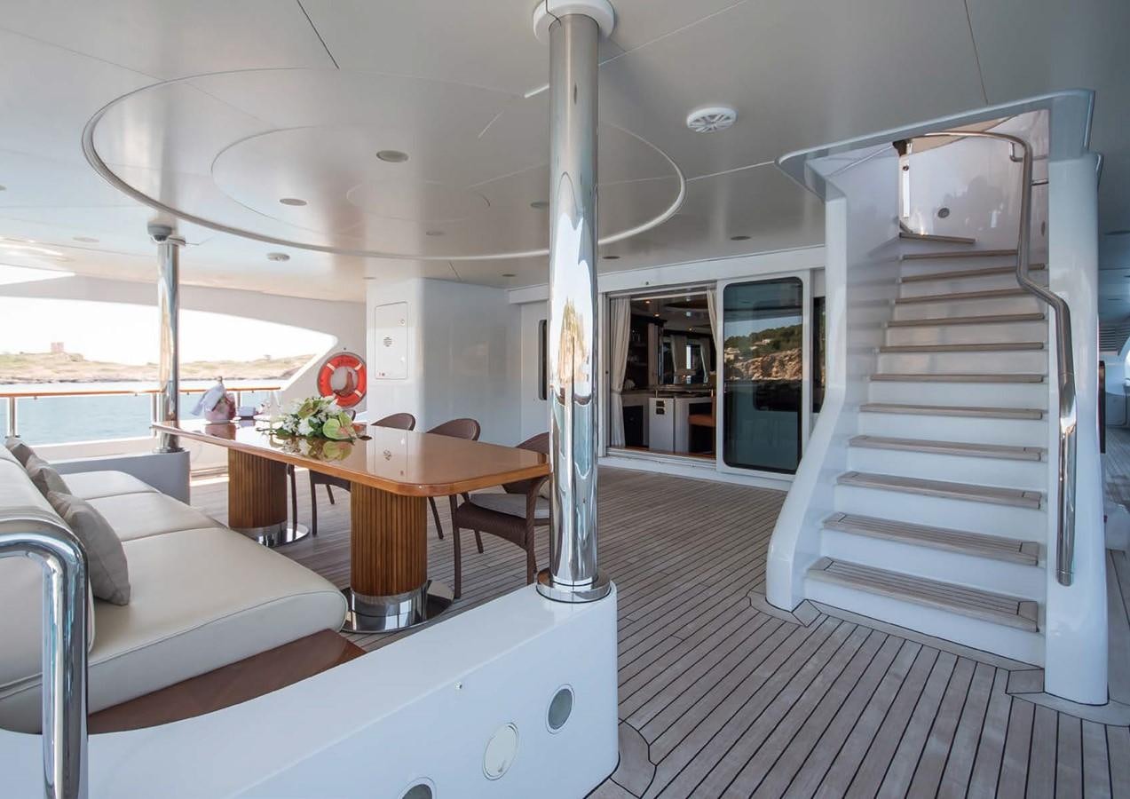 a room with a table and a couch aboard DIANE Yacht for Sale