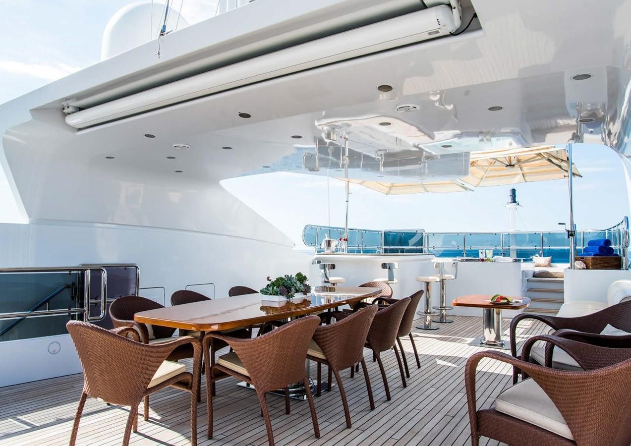 a large room with tables and chairs aboard DIANE Yacht for Sale