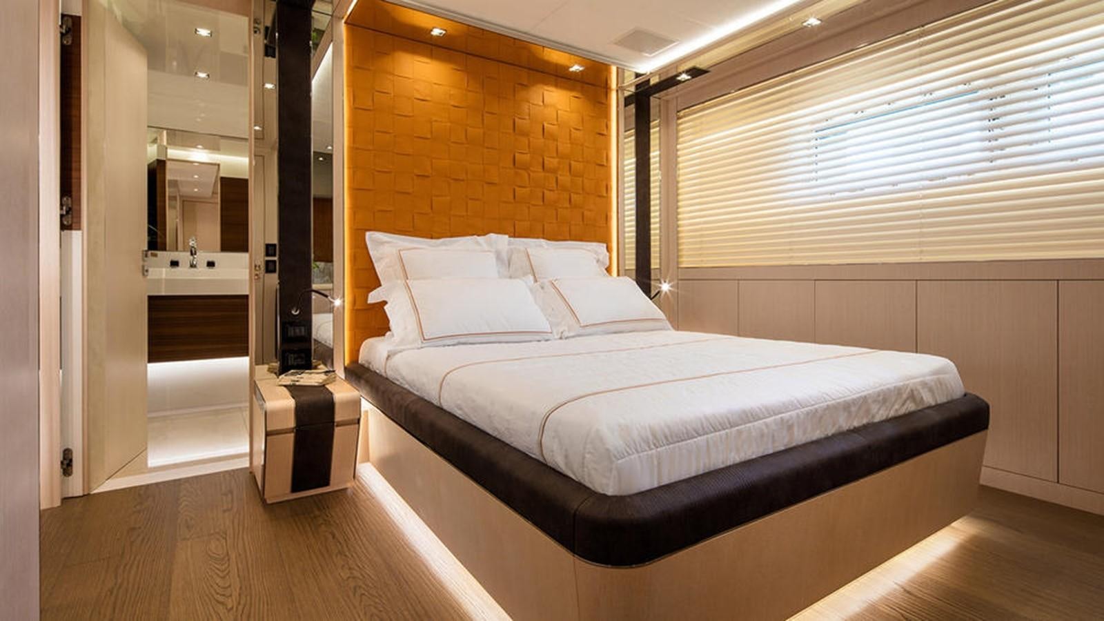 a bed in a room aboard NAMASTE Yacht for Charter
