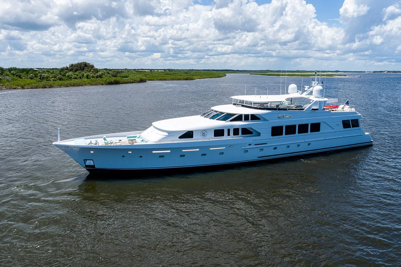 a white boat on water aboard LA SIRENA Yacht for Sale