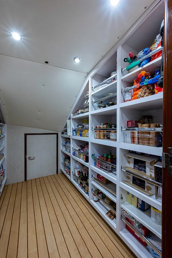 a white refrigerator with shelves aboard LA SIRENA Yacht for Sale