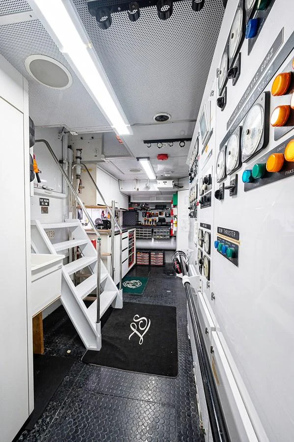 a hallway with a row of white machines aboard LA SIRENA Yacht for Sale