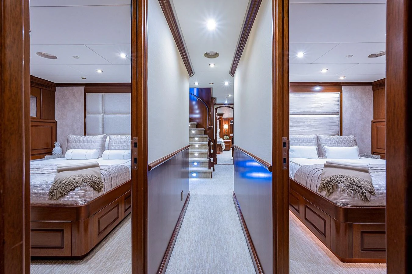 a room with a bed and a mirror aboard LA SIRENA Yacht for Sale