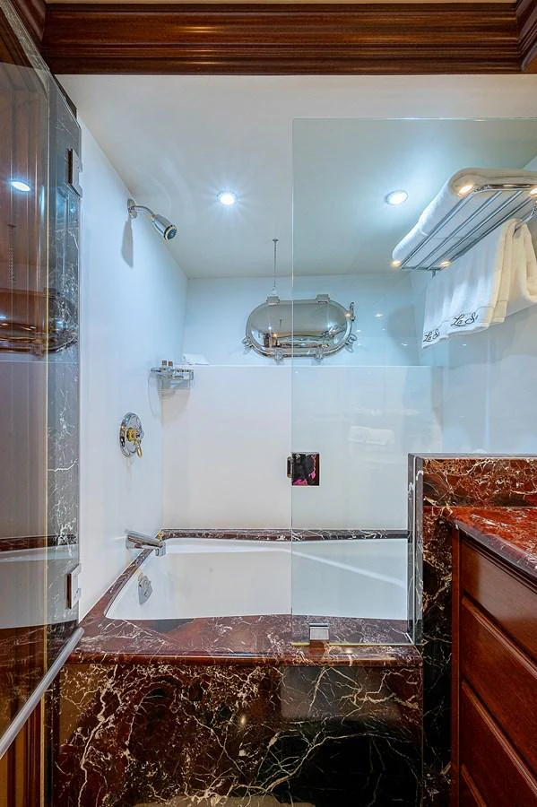 a bathroom with a shower and a sink aboard LA SIRENA Yacht for Sale
