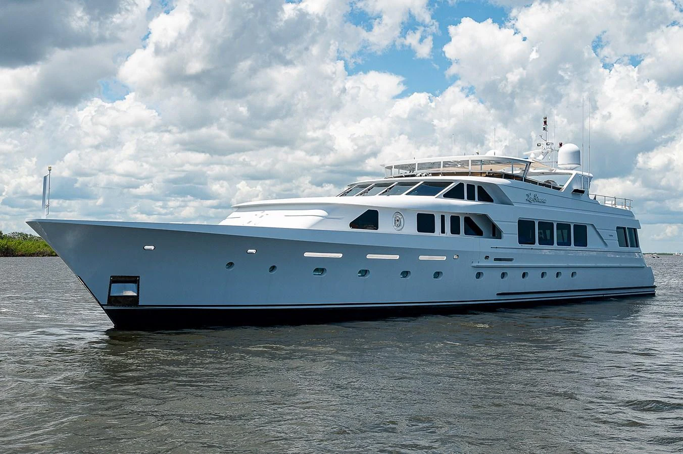 a white yacht on the water aboard LA SIRENA Yacht for Sale