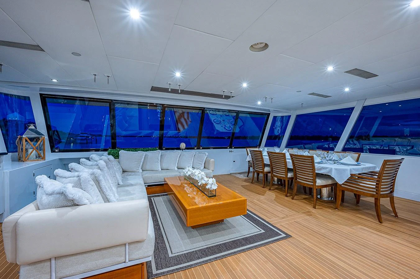 a living room with a large blue screen aboard LA SIRENA Yacht for Sale