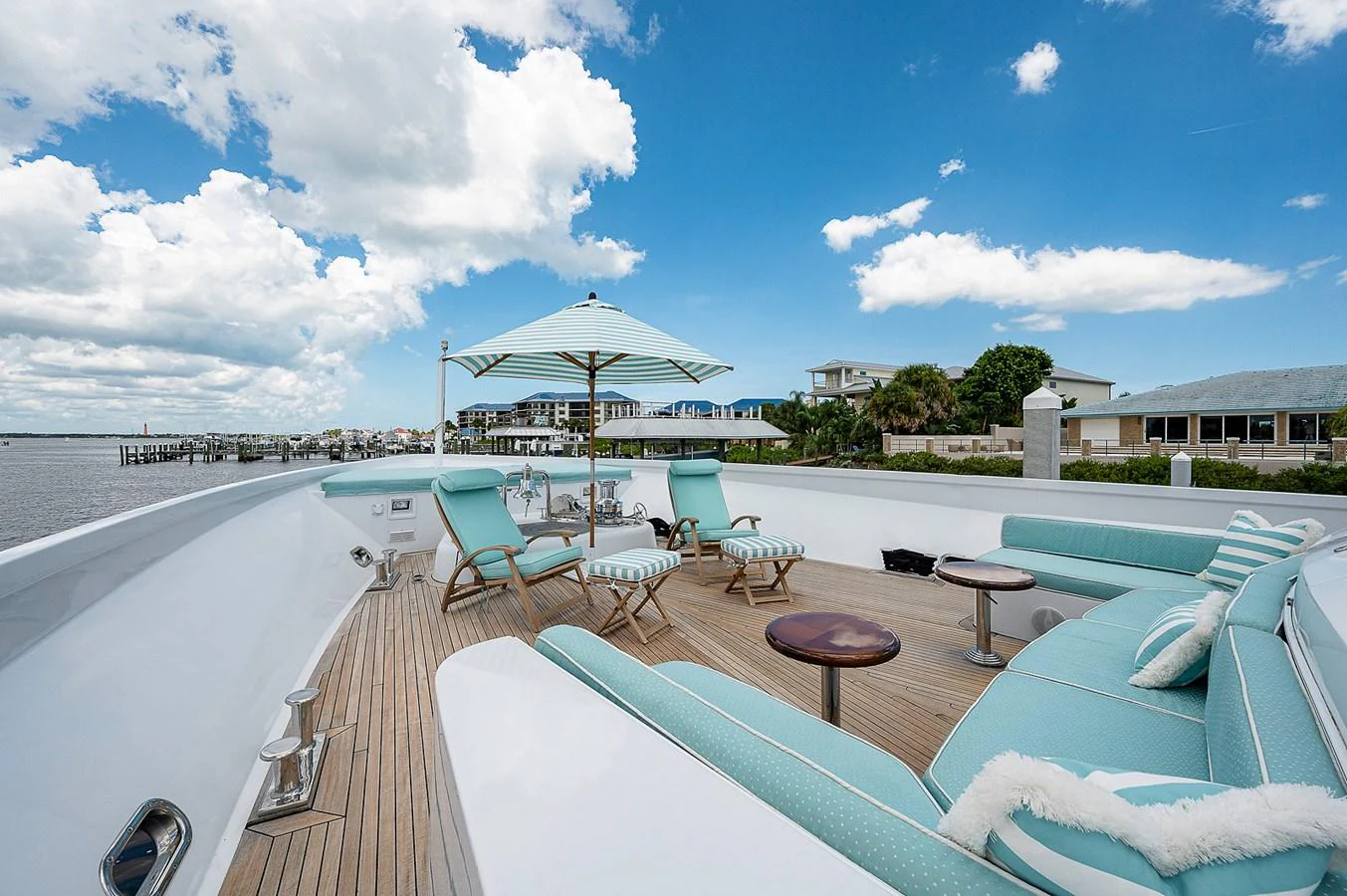 a deck with a pool and lounge chairs on it aboard LA SIRENA Yacht for Sale