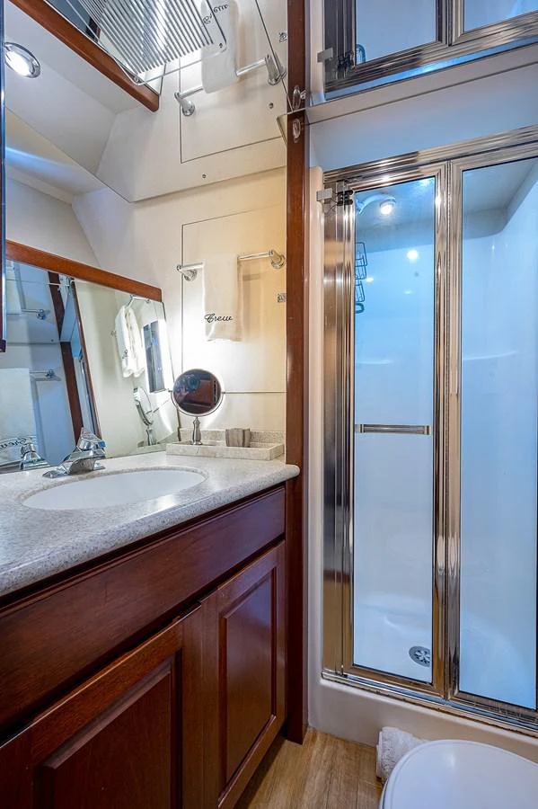 a bathroom with a sink and a mirror aboard LA SIRENA Yacht for Sale