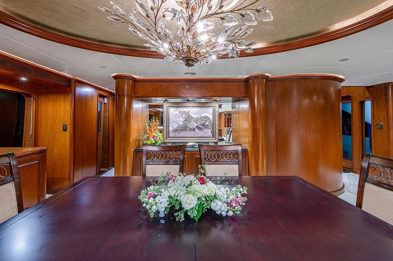 a large room with a table and chairs aboard LA SIRENA Yacht for Sale