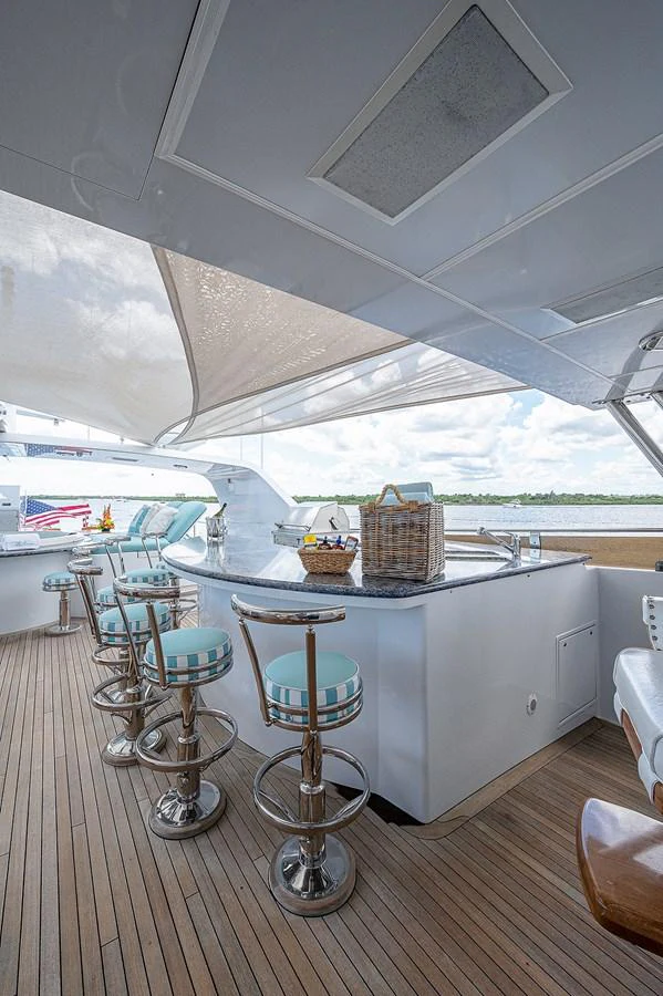 a room with tables and chairs aboard LA SIRENA Yacht for Sale