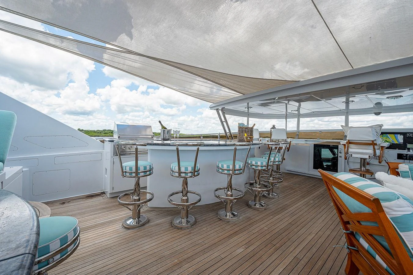 a room with tables and chairs aboard LA SIRENA Yacht for Sale