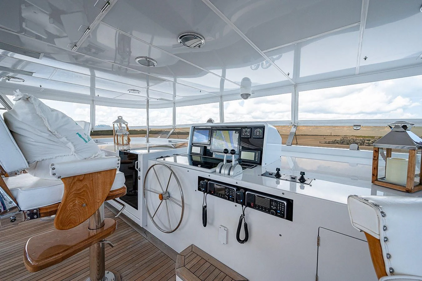 a room with a large white table and chairs and a large white object with a black object on aboard LA SIRENA Yacht for Sale