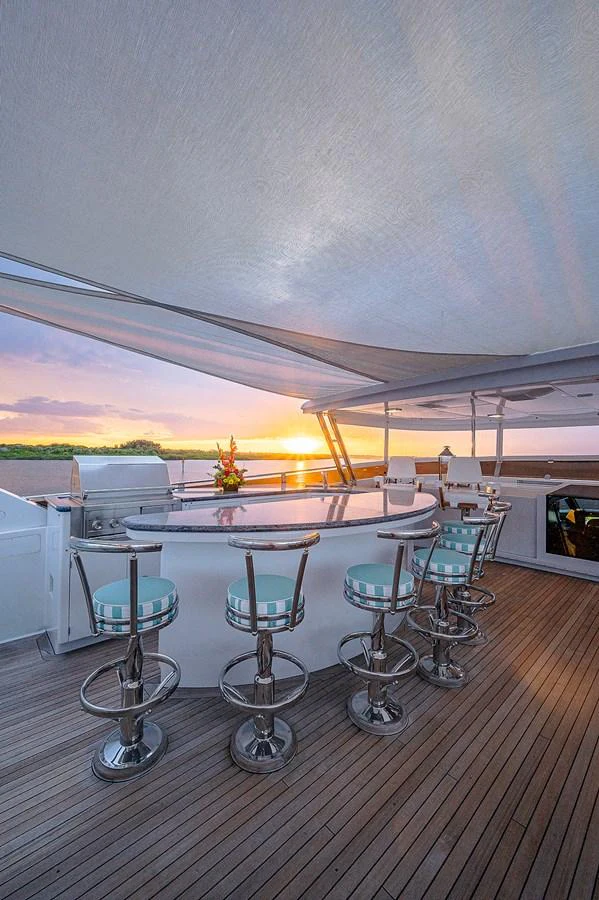 a table and chairs in a room aboard LA SIRENA Yacht for Sale