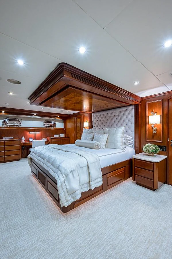a bedroom with a large bed aboard LA SIRENA Yacht for Sale