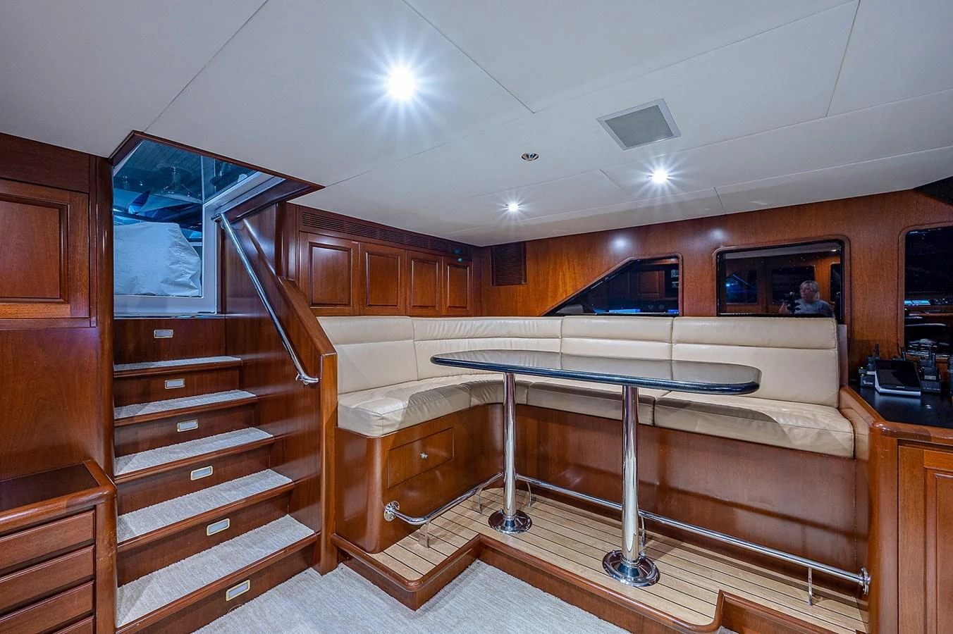 a room with a bed and a table aboard LA SIRENA Yacht for Sale