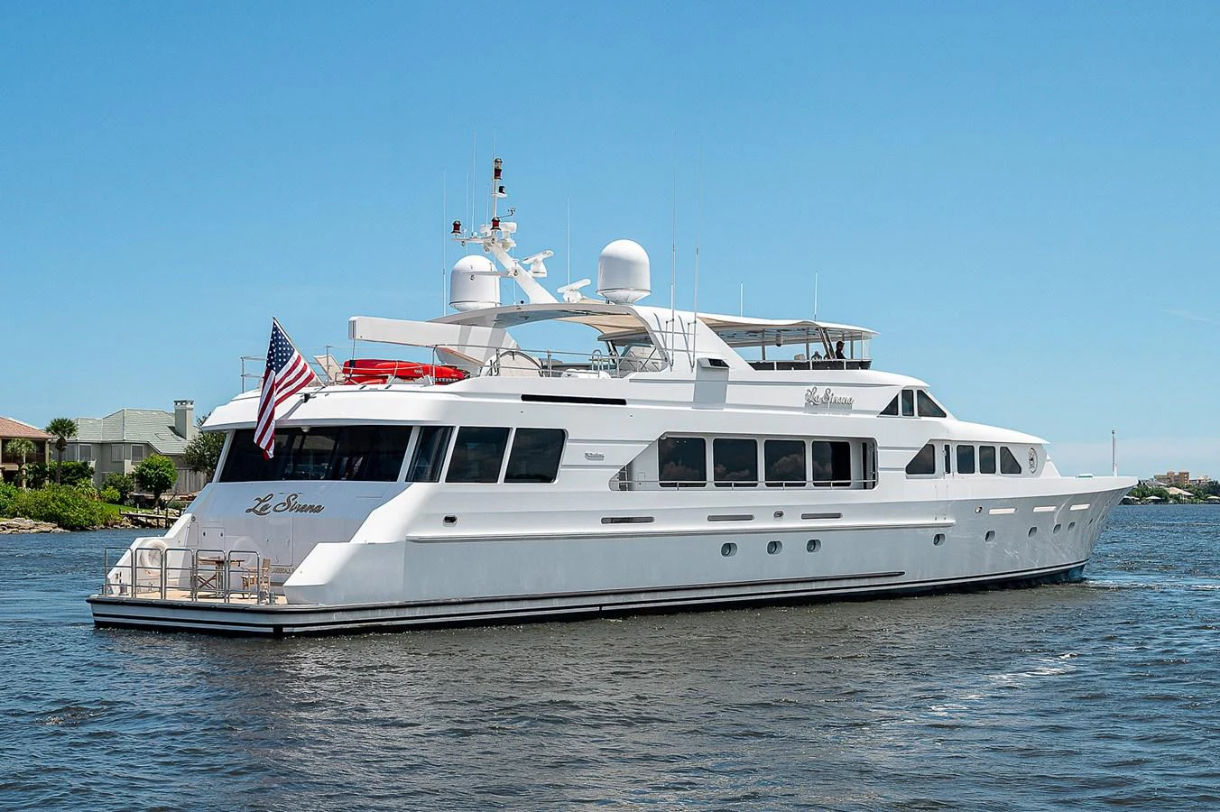 a large white boat on the water aboard LA SIRENA Yacht for Sale
