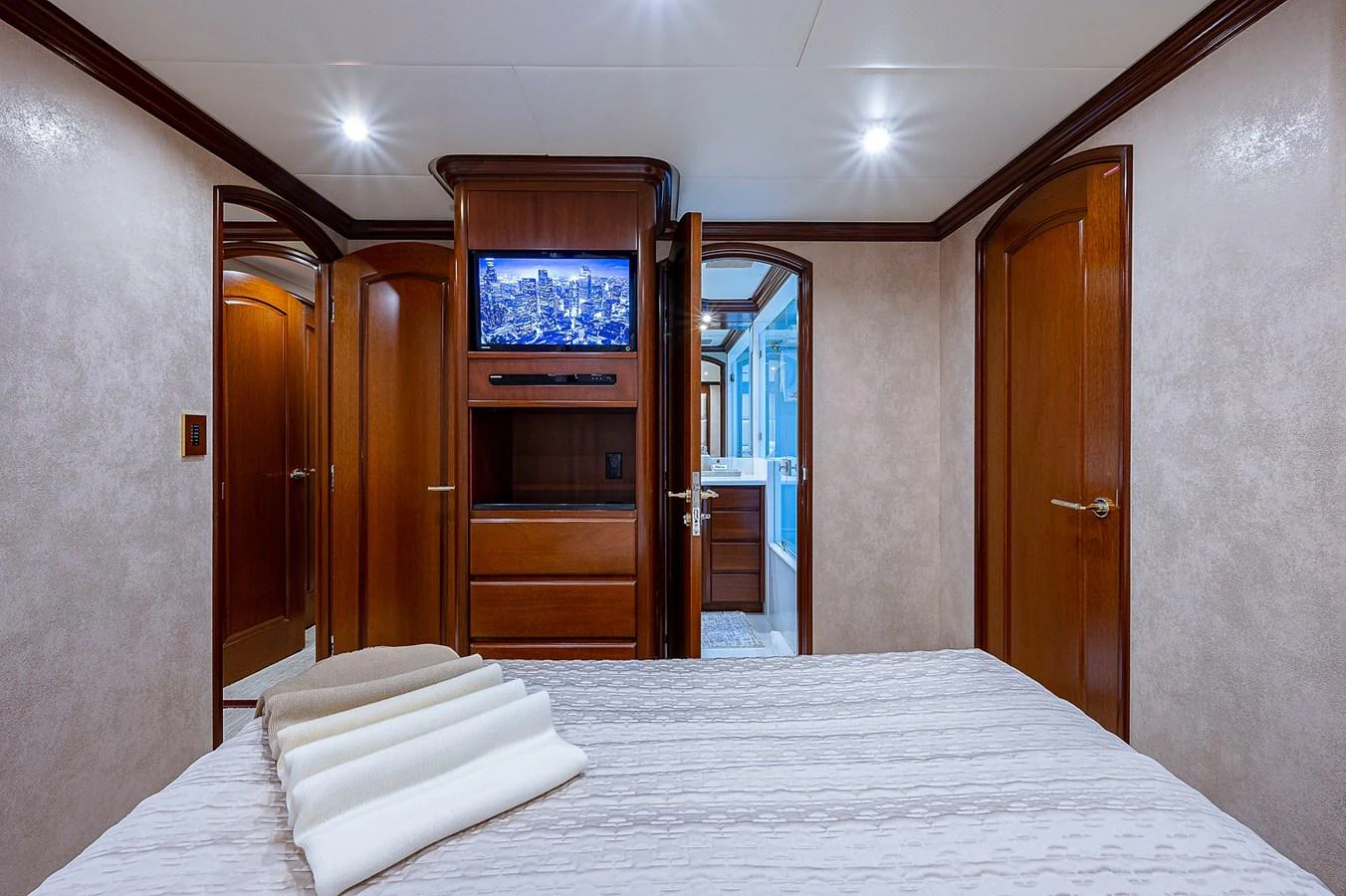 a hotel room with a tv on the wall aboard LA SIRENA Yacht for Sale