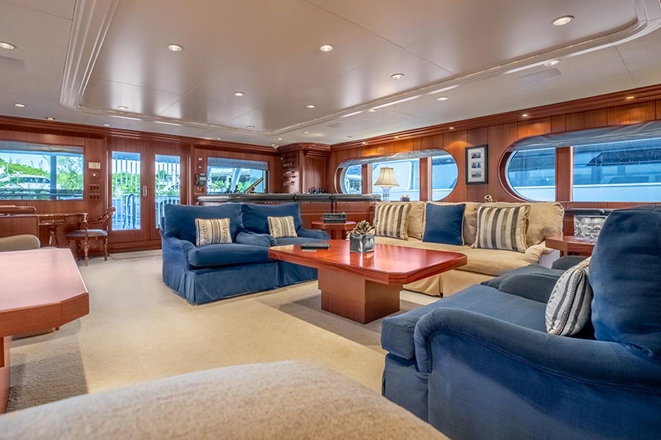 a living room with a large window aboard NEVER ENOUGH Yacht for Sale