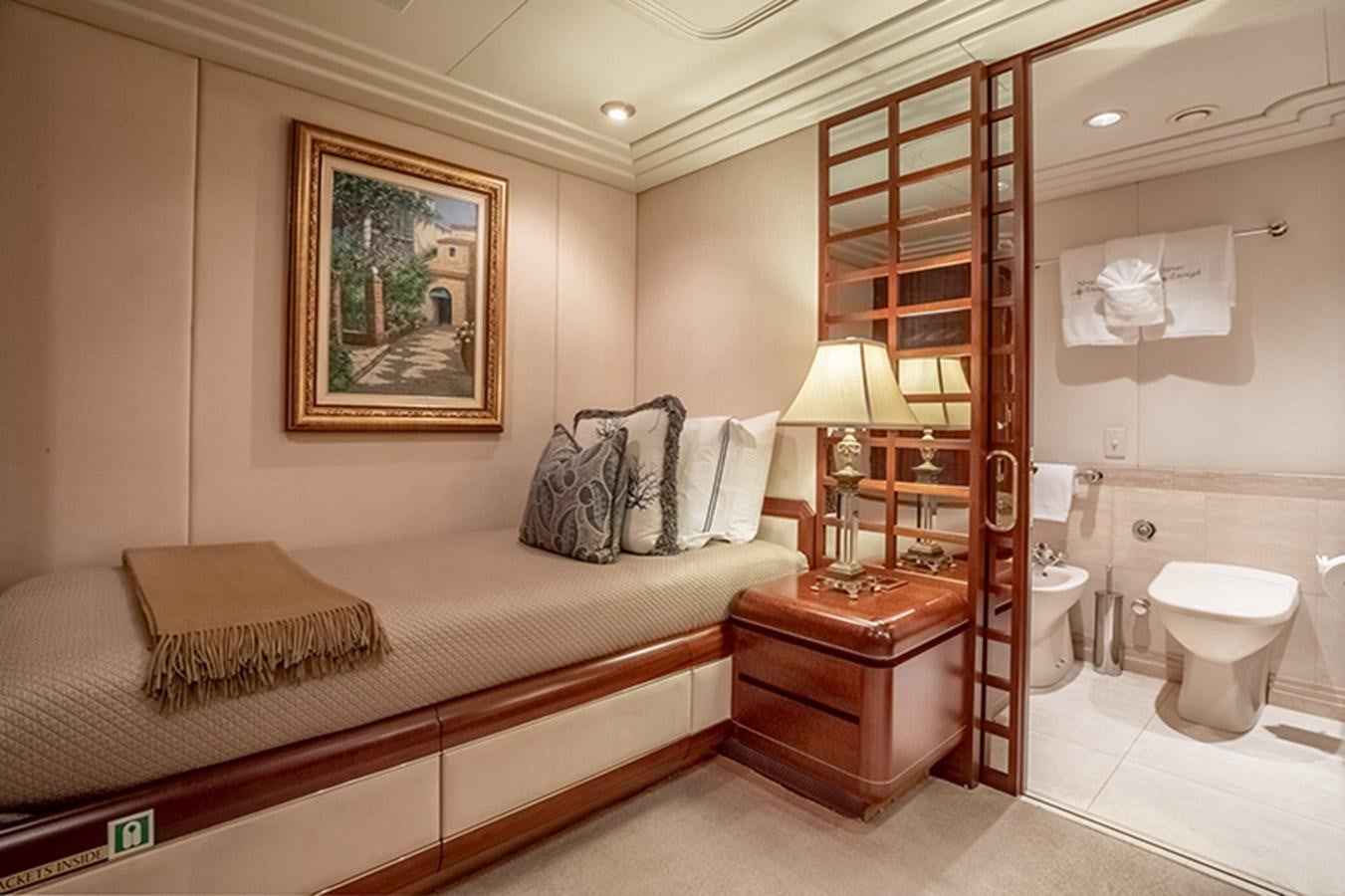 a bathroom with a bed and a mirror aboard NEVER ENOUGH Yacht for Sale