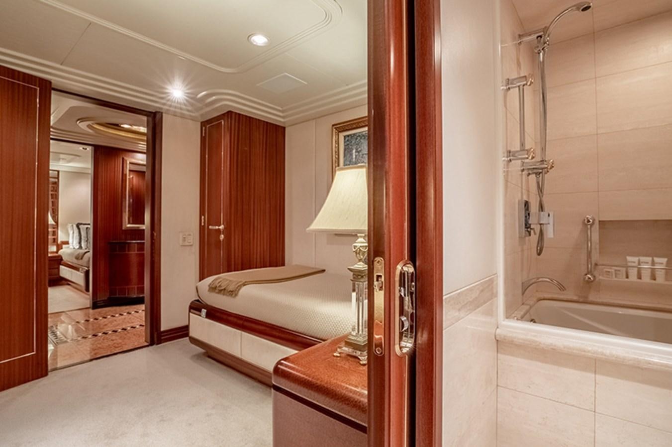 a bathroom with a tub sink and a mirror aboard NEVER ENOUGH Yacht for Sale