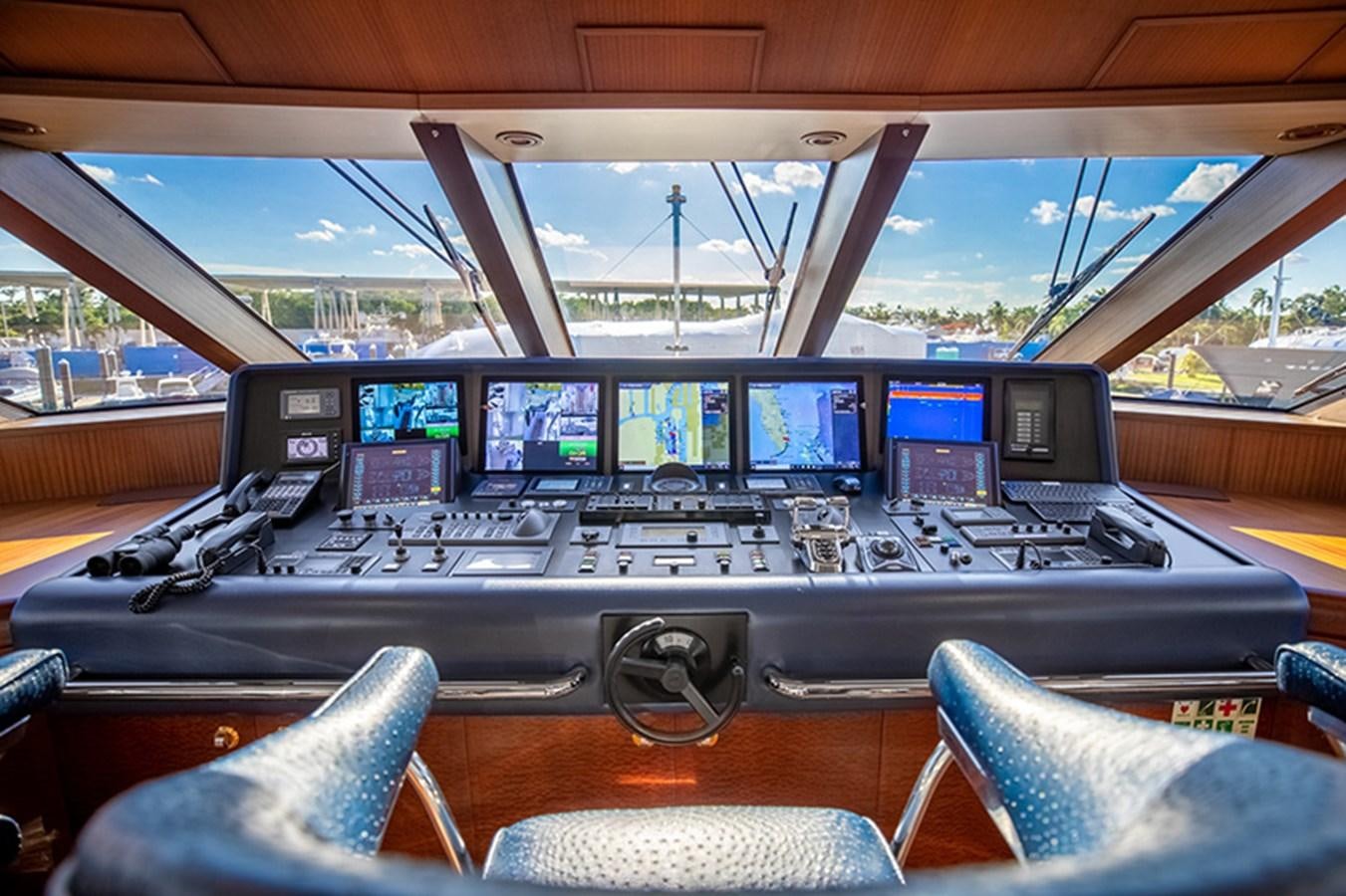 inside of a vehicle with many monitors aboard NEVER ENOUGH Yacht for Sale