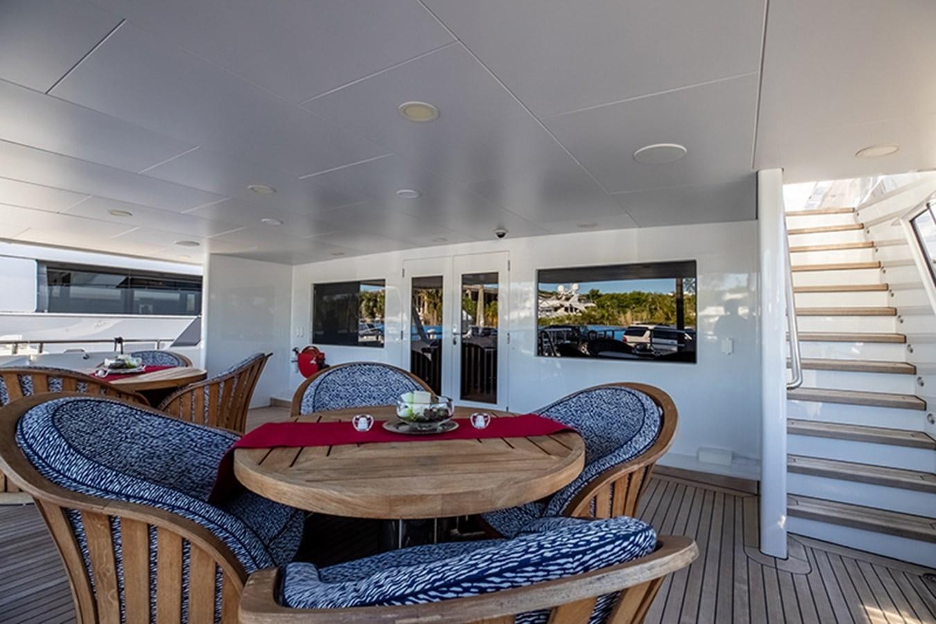 a living room with a couch and a television aboard NEVER ENOUGH Yacht for Sale