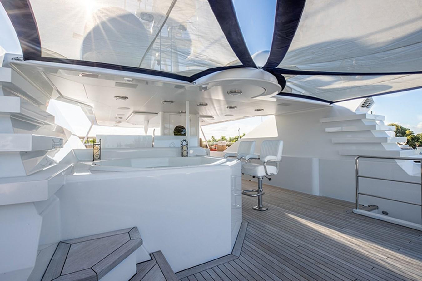 a room with white walls and a wood floor aboard NEVER ENOUGH Yacht for Sale