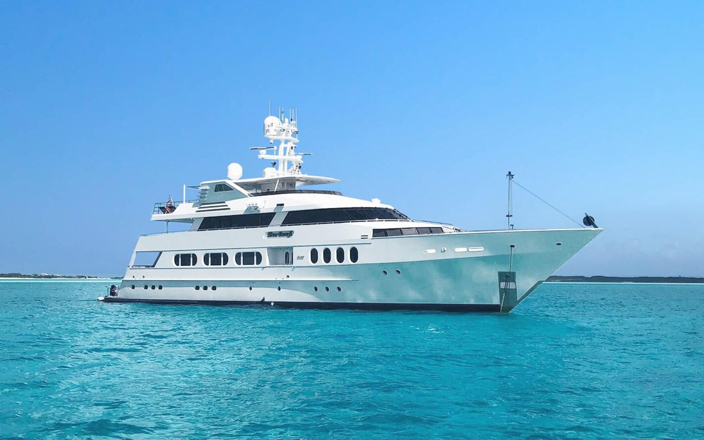 a white boat in the water aboard NEVER ENOUGH Yacht for Sale