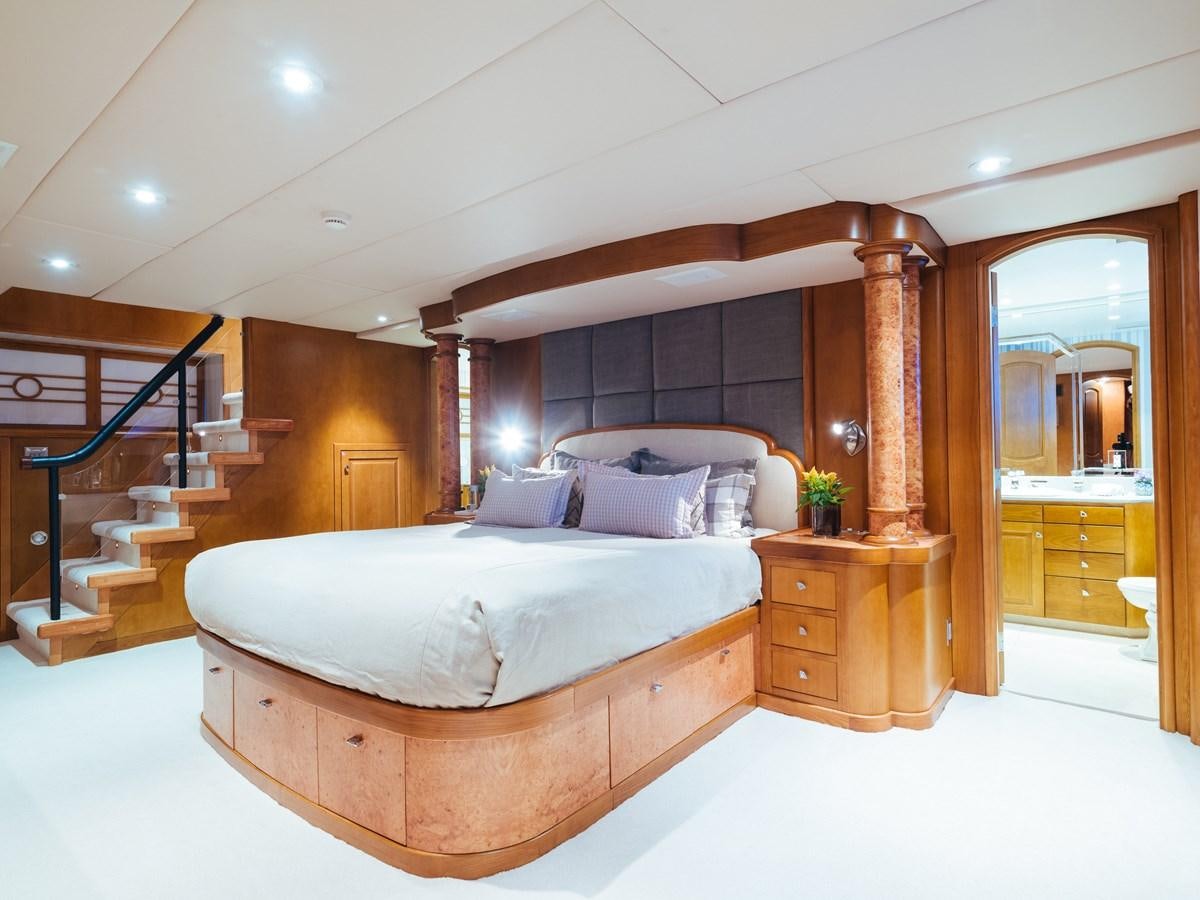 a large bedroom with a large bed aboard DAYDREAM Yacht for Sale